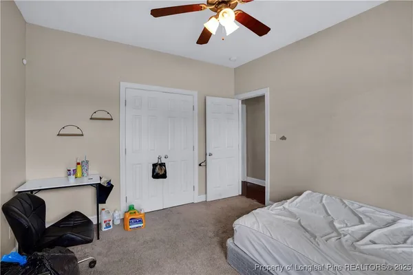 a bedroom with a workspace