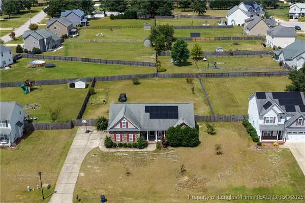 an aerial view of a house with a ocean view