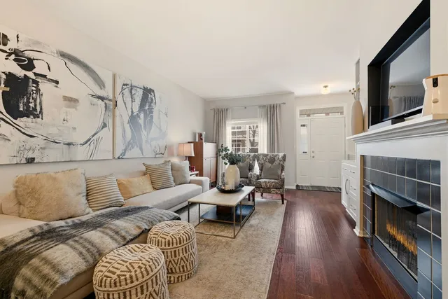 a living room with furniture fireplace and flat screen tv