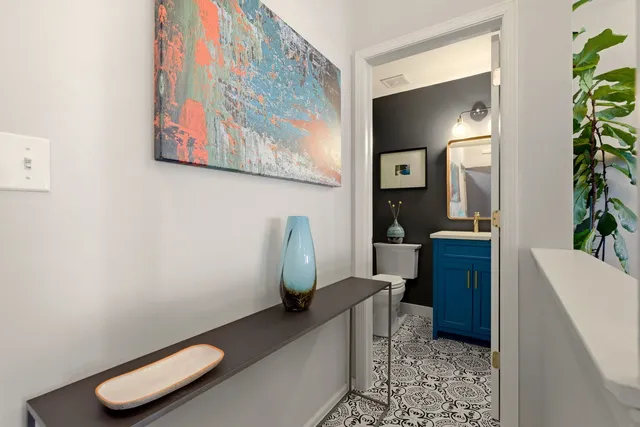 a living room with furniture and a potted plant