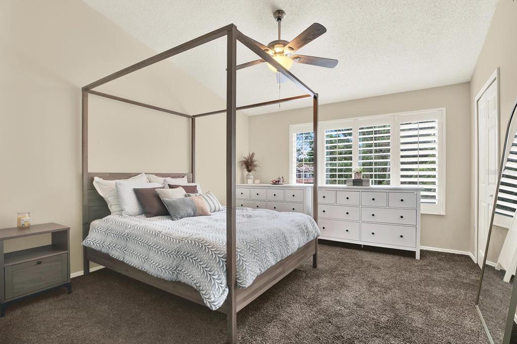 8541 Hunters Key Circle Tampa, FL 33647 - Photo 13 of 24 a bedroom with a bed and a window