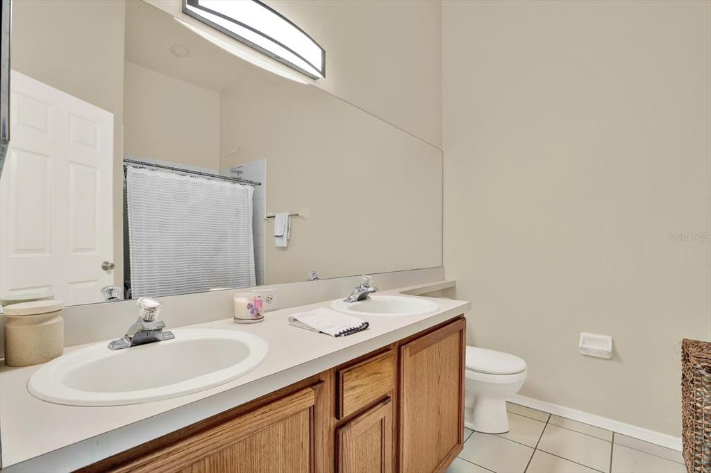 8541 Hunters Key Circle Tampa, FL 33647 - Photo 15 of 24 a bathroom with a sink and a mirror
