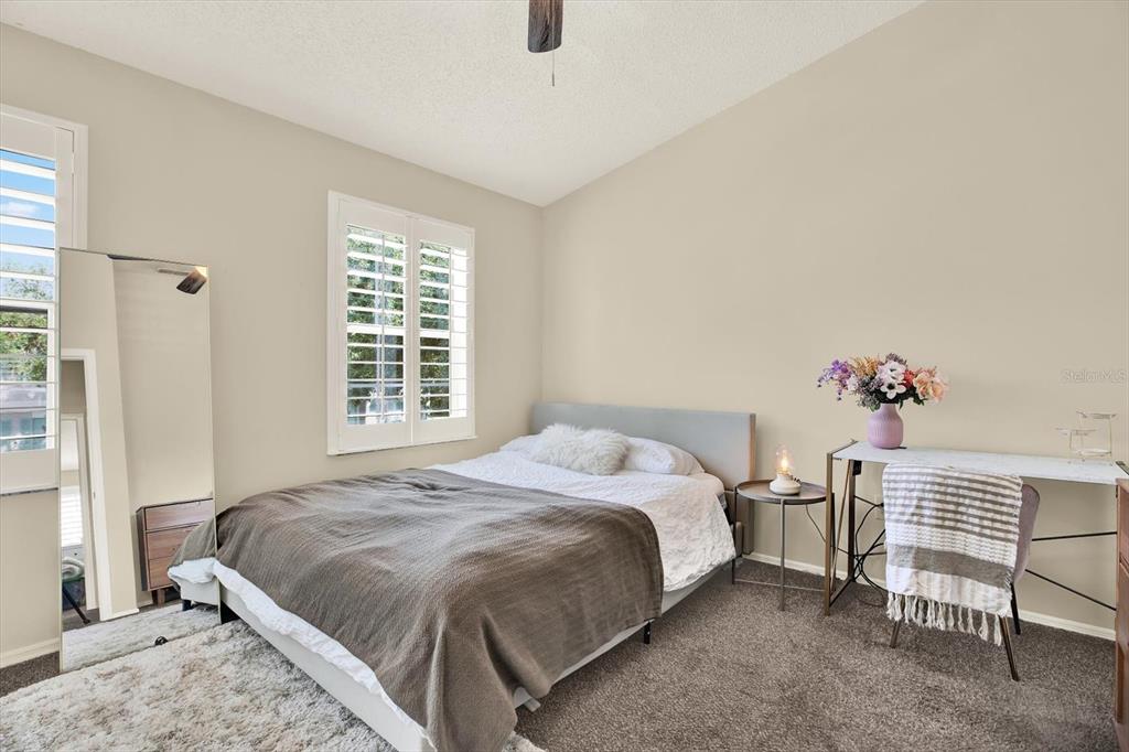 8541 Hunters Key Circle Tampa, FL 33647 - Photo 16 of 24 a bedroom with a bed and a window