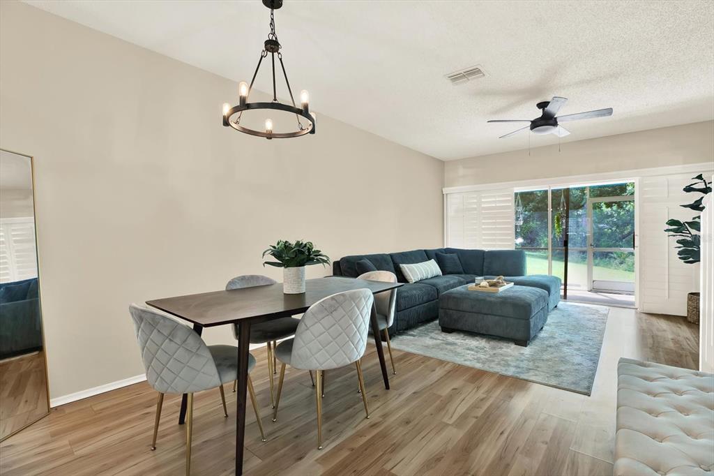 8541 Hunters Key Circle Tampa, FL 33647 - Photo 4 of 24 a living room with furniture and wooden floor