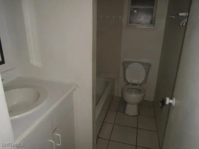 a bathroom with a sink and toilet