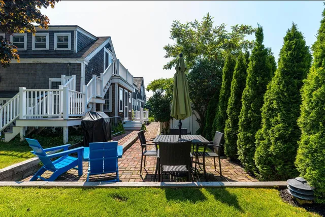 a view of a house with swimming pool and sitting area