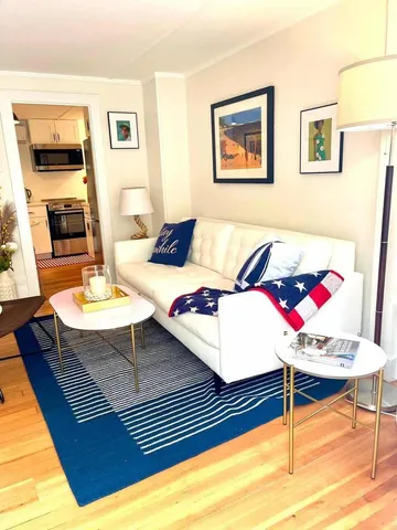 a living room with furniture and a table