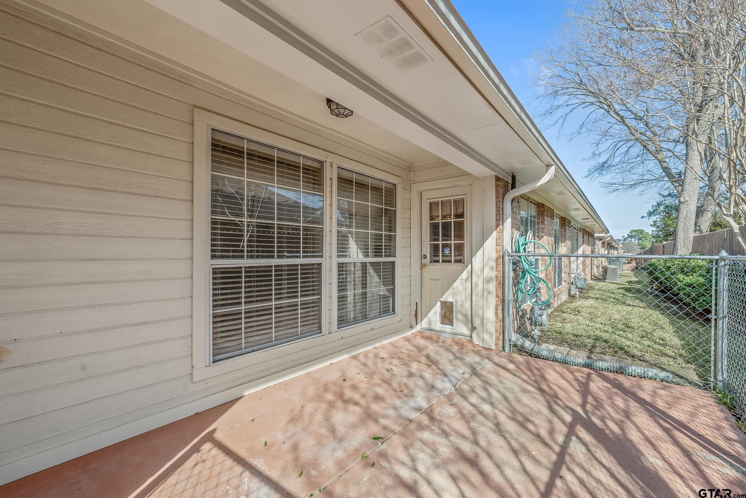 1202 Rice Road, Unit 135 Tyler, TX 75703 - Photo 20 of 21 a view of a house with a large window