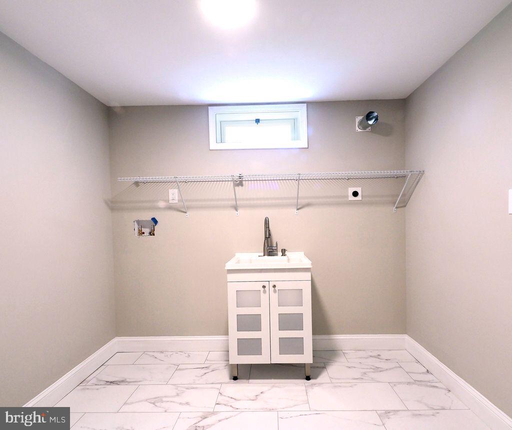 13612 Brookline Road Baldwin, MD 21013 - Photo 26 of 44 Laundry Room with new ceramic flooring and sink
