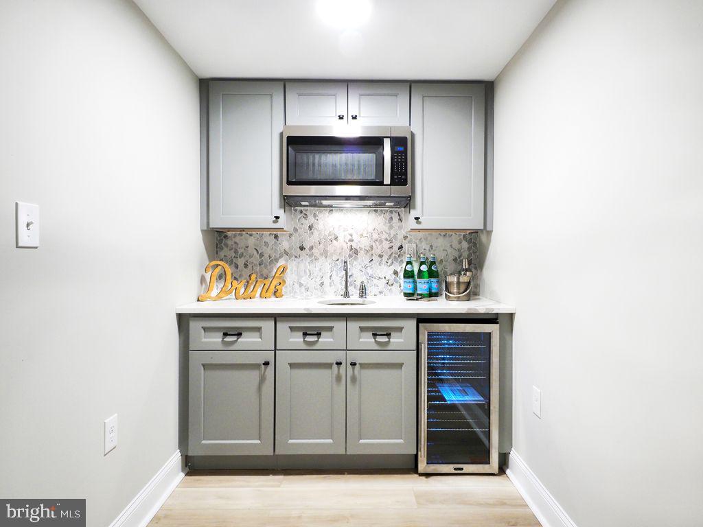 13612 Brookline Road Baldwin, MD 21013 - Photo 7 of 44 Wet Bar in the Lower Level Family Room w/ Fridge