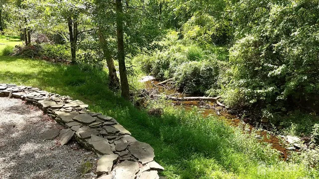 a backyard of a house with lots of green space