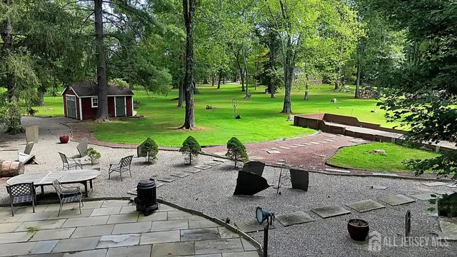 a view of a backyard with sitting area