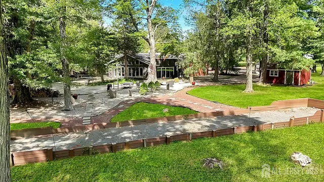a view of a park with large trees