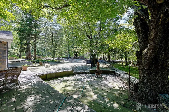 a view of a backyard with large trees