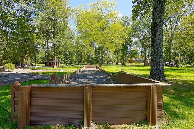 a view of a park with large trees