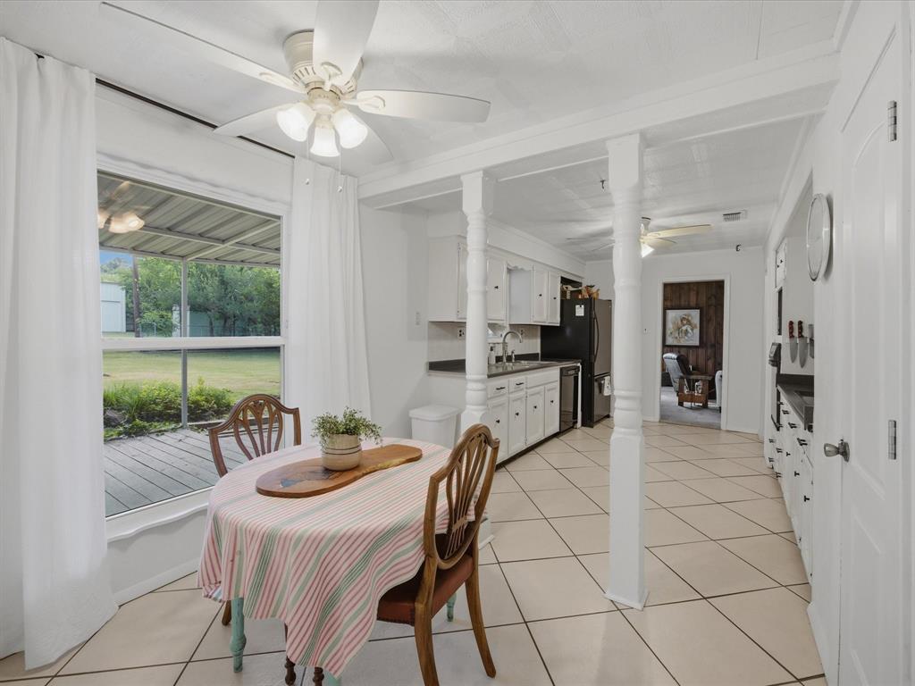 907 4th Street Graham, TX 76450 - Photo 11 of 34 a dining room with furniture and window