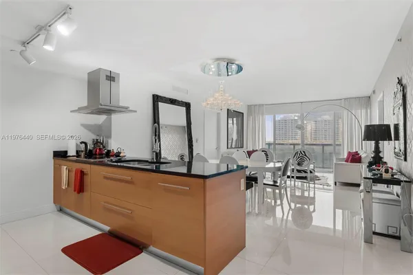 a view of a living room and kitchen