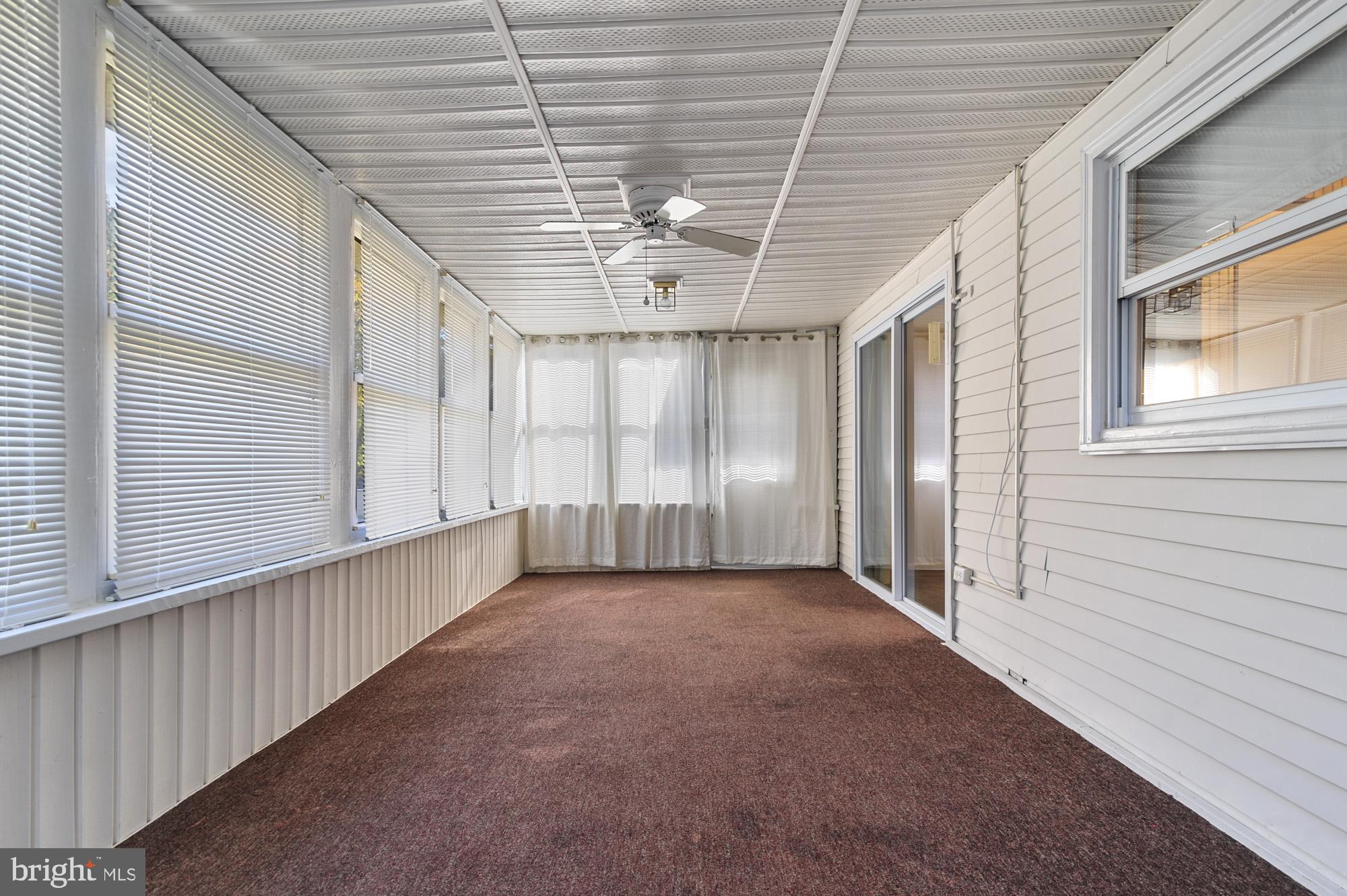 90 Katherine Drive Dover, DE 19901 - Photo 13 of 26 a view of a hallway with wooden stairs