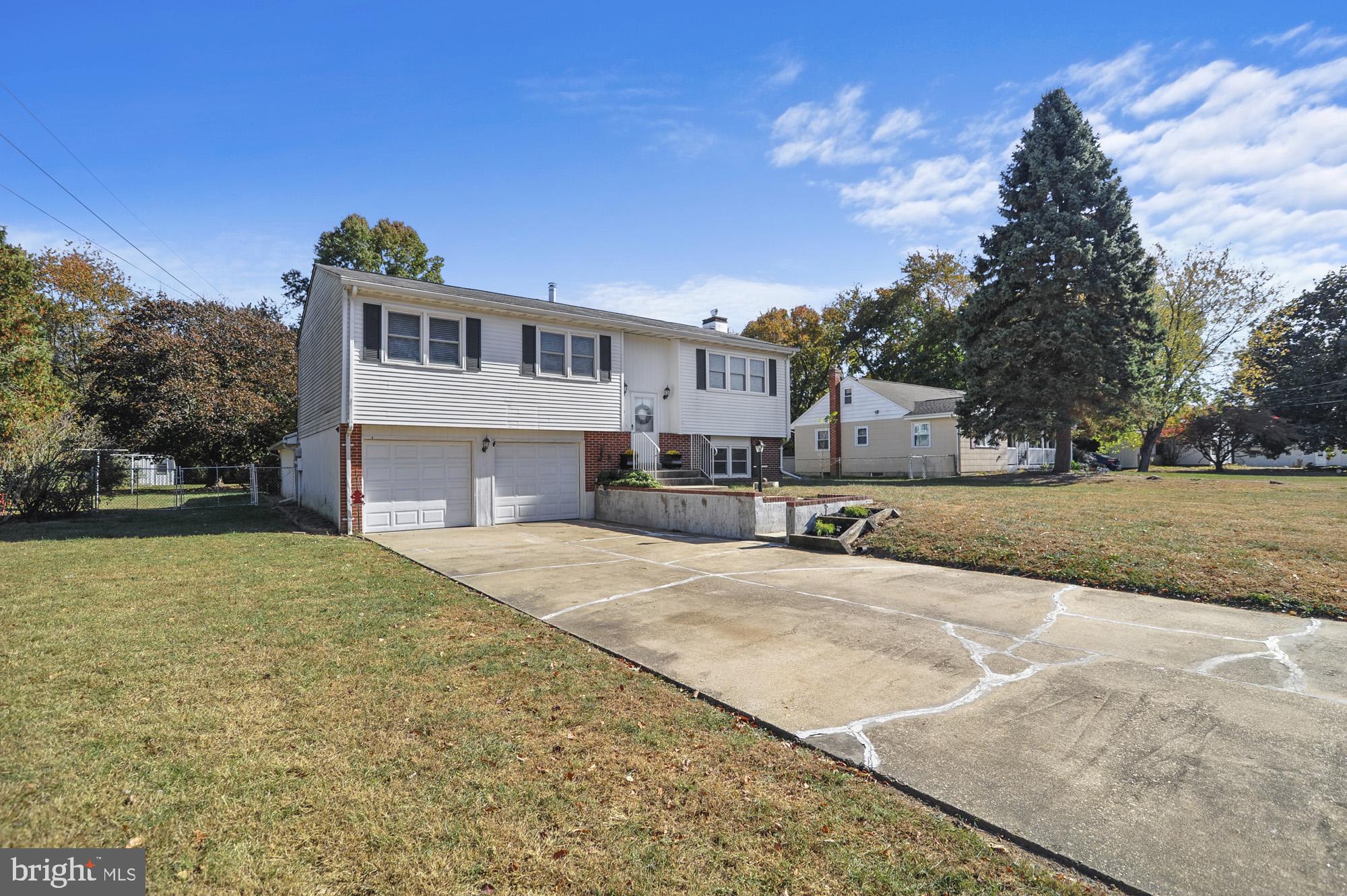 90 Katherine Drive Dover, DE 19901 - Photo 26 of 26 a front view of a house with a yard and garage