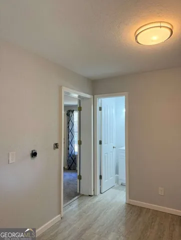 a bathroom with a sink toilet and mirror