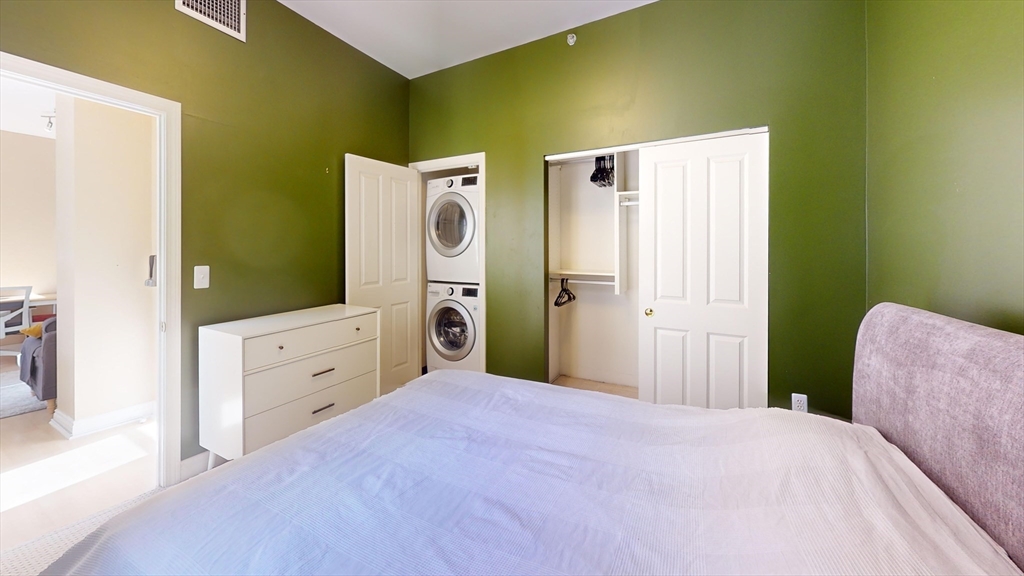 4 Charlesgate East, Unit 107 Boston, MA 02215 - Photo 5 of 23 a bedroom with a bed and a dresser