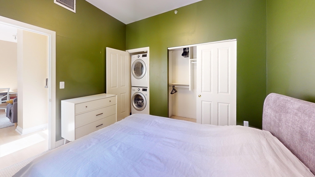 4 Charlesgate East, Unit 107 Boston, MA 02215 - Photo 5 of 23 a bedroom with a bed and a dresser