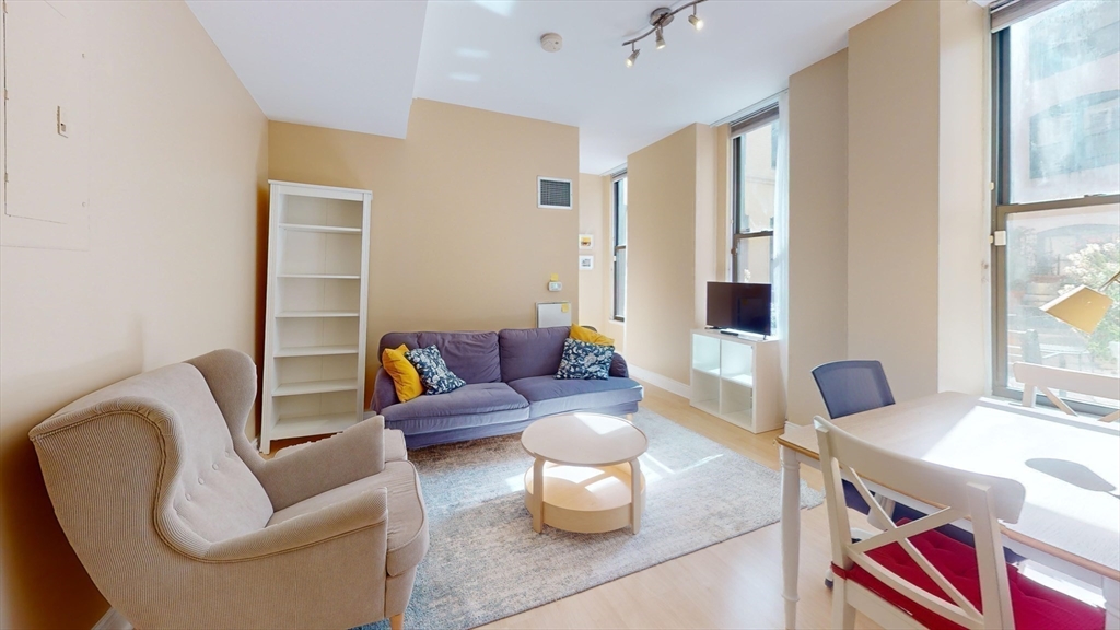 4 Charlesgate East, Unit 107 Boston, MA 02215 - Photo 6 of 23 a living room with furniture and a potted plant