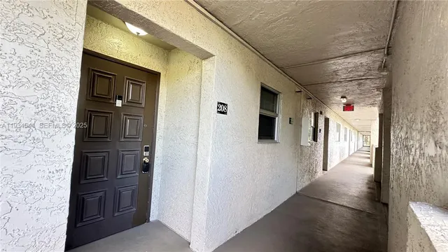 a view of a hallway with wooden shelves