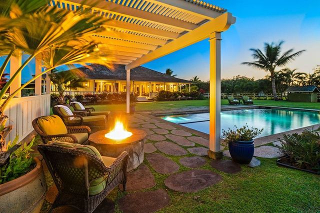 a view of a swimming pool with a patio