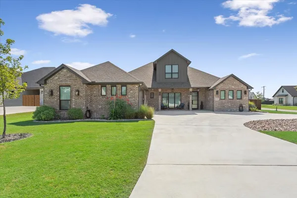 a front view of a house with yard