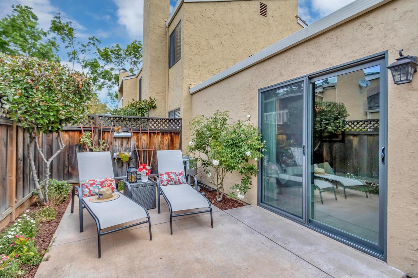 6609 Folklore Court San Jose, CA 95120 - Photo 17 of 21 a view of a patio with a table and chairs and potted plants