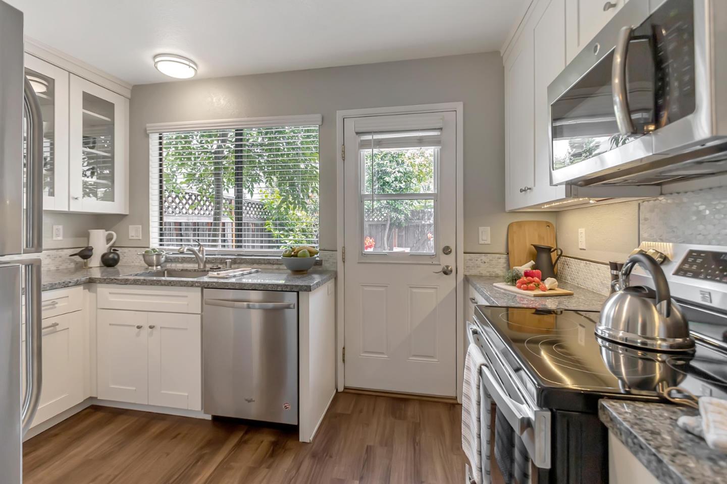 6609 Folklore Court San Jose, CA 95120 - Photo 5 of 21 a kitchen with a sink cabinets and wooden floor