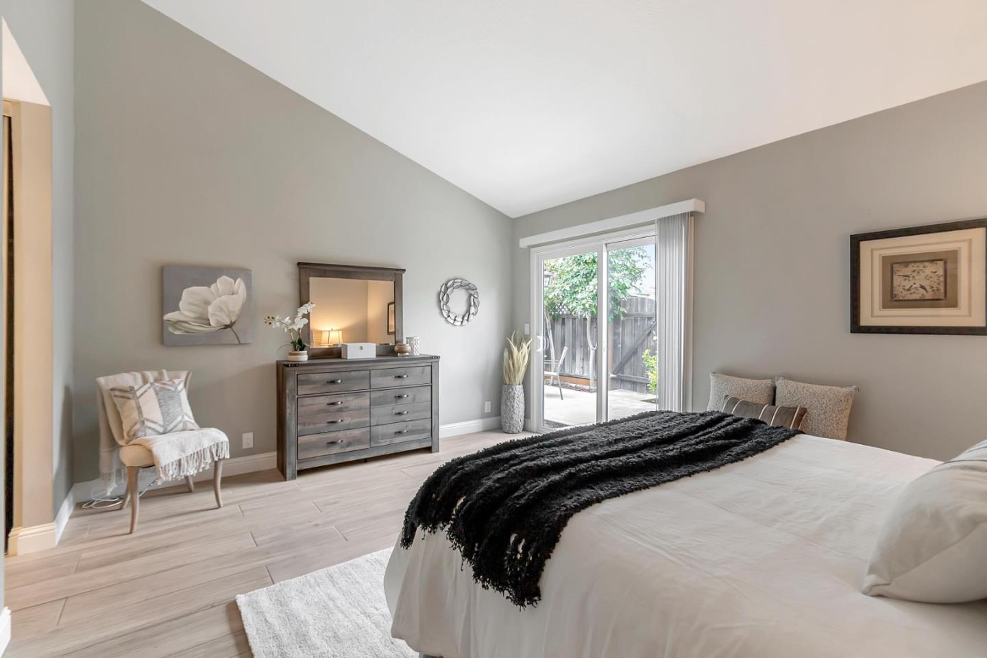 6609 Folklore Court San Jose, CA 95120 - Photo 8 of 21 a bedroom with a bed and a chair