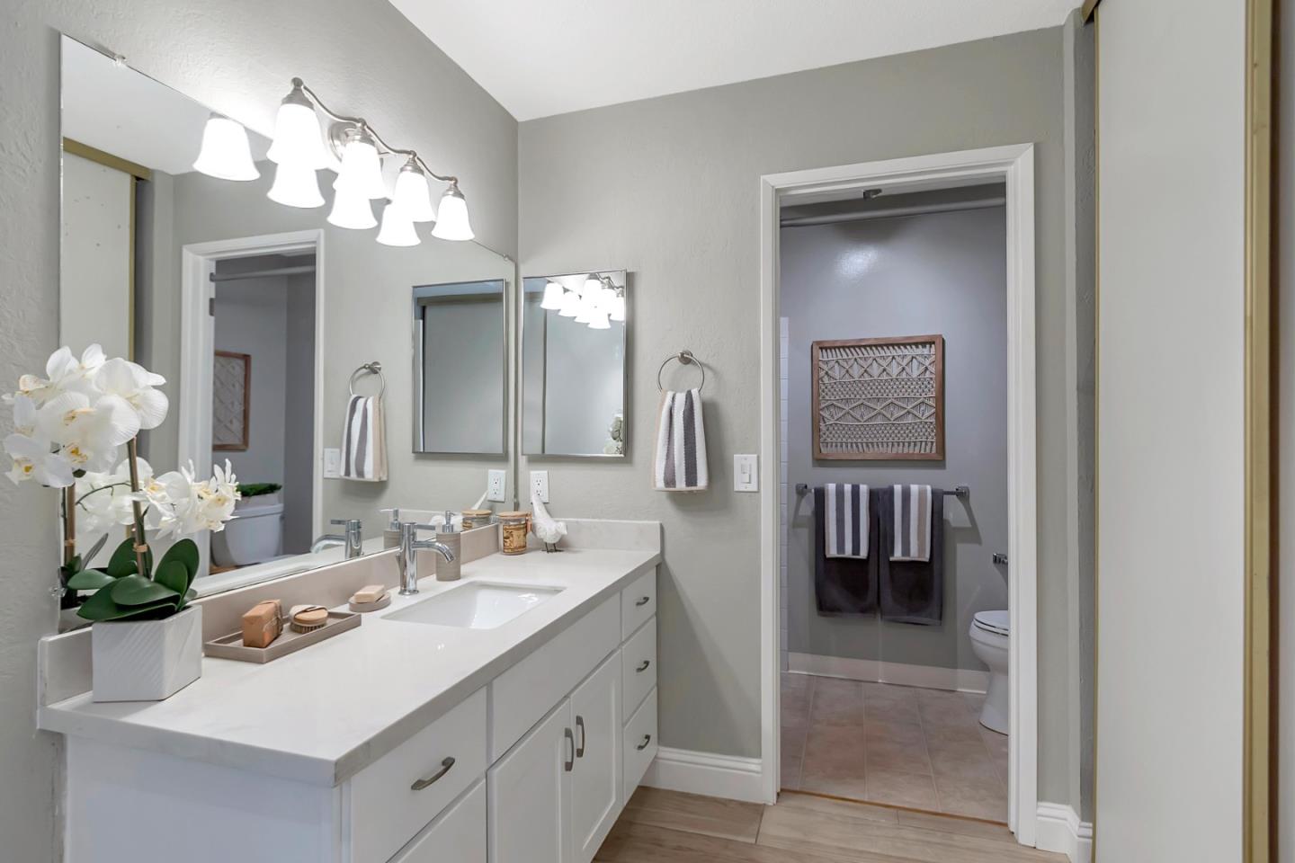 6609 Folklore Court San Jose, CA 95120 - Photo 9 of 21 a bathroom with a sink double vanity and a mirror