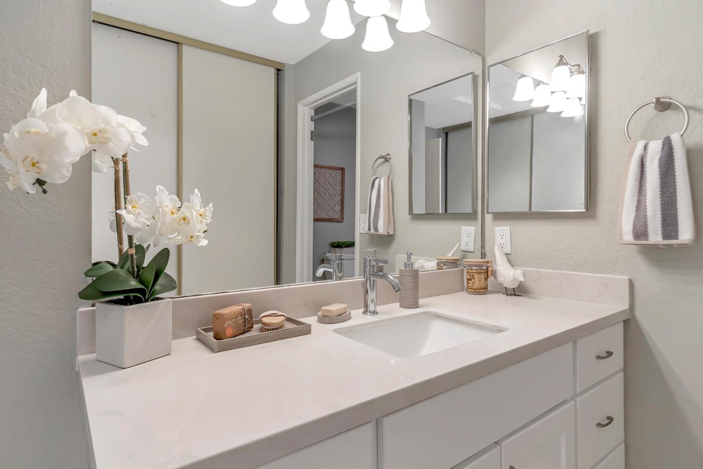 6609 Folklore Court San Jose, CA 95120 - Photo 10 of 21 a bathroom with a sink a vanity and a mirror