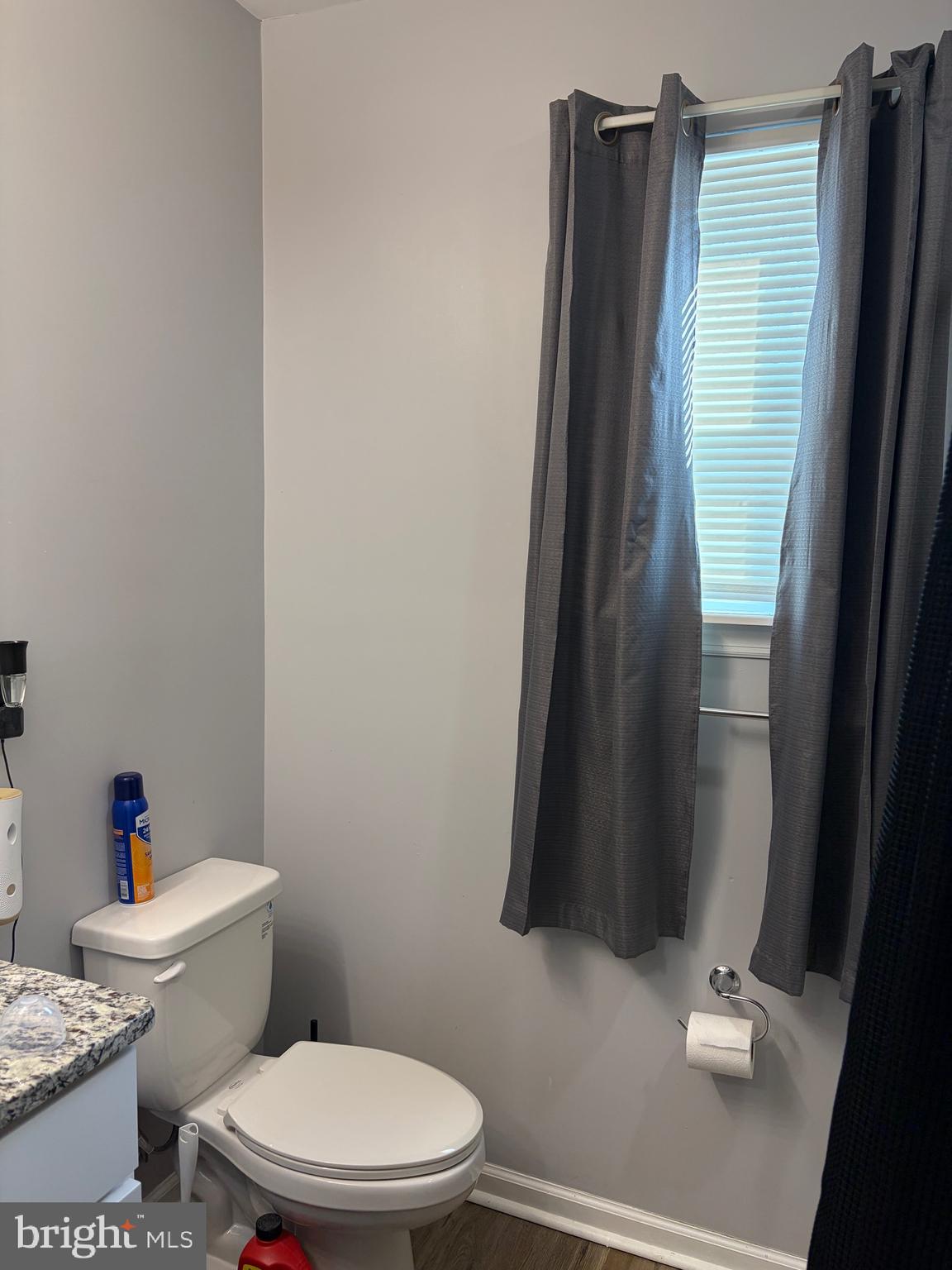 34 B Maynard Drive Sicklerville, NJ 08081 - Photo 13 of 24 a white toilet sitting next to a shower curtain