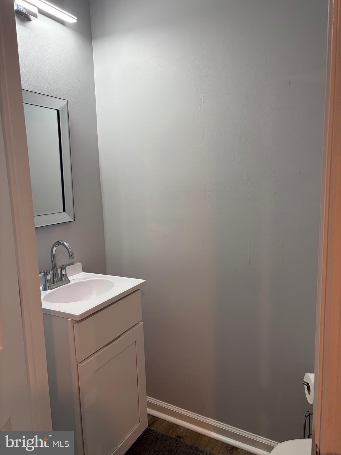 34 B Maynard Drive Sicklerville, NJ 08081 - Photo 19 of 24 a bathroom with a sink and vanity