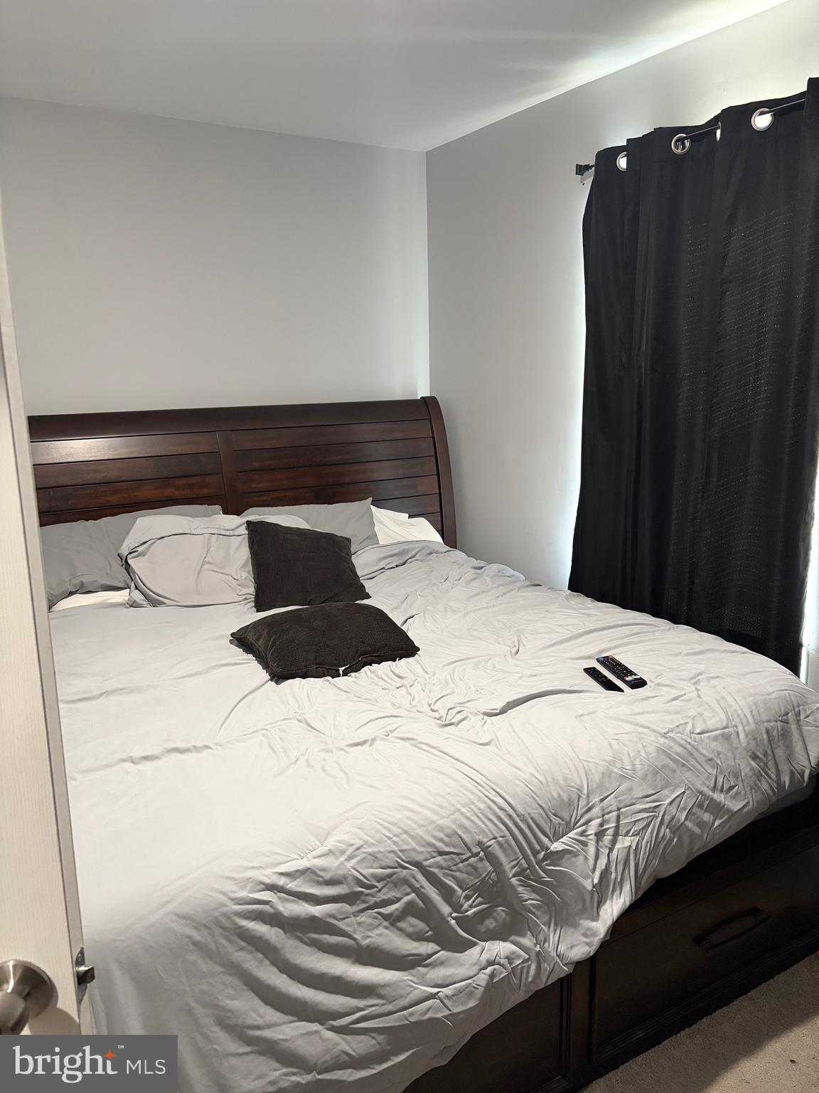 34 B Maynard Drive Sicklerville, NJ 08081 - Photo 8 of 24 a bedroom with a bed and a black white bedspread