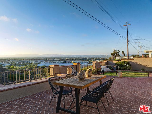 a view of a terrace with furniture