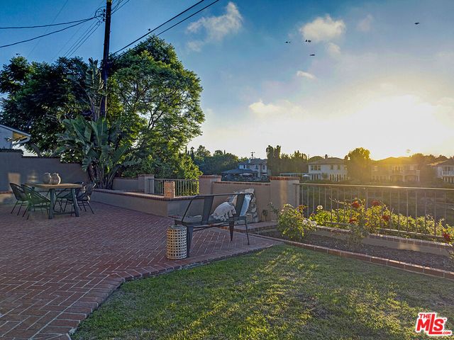 a view of a chairs and table in the patio