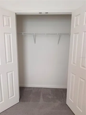 a bathroom with a granite countertop toilet a sink and bathtub
