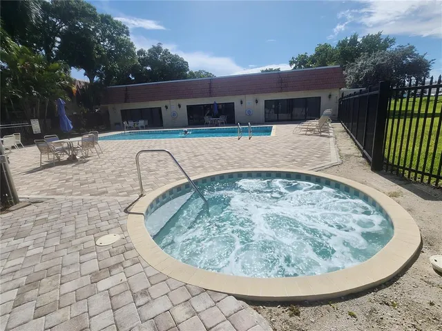 a view of swimming pool with a patio