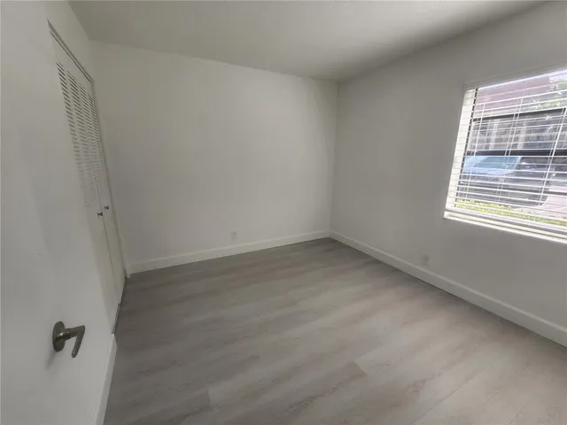 a bathroom with a sink toilet and mirror