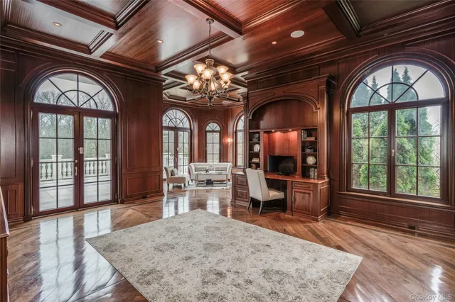 a view of a livingroom with furniture window and wooden floor