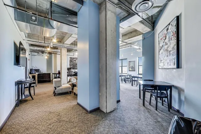 a view of a livingroom with furniture and windows