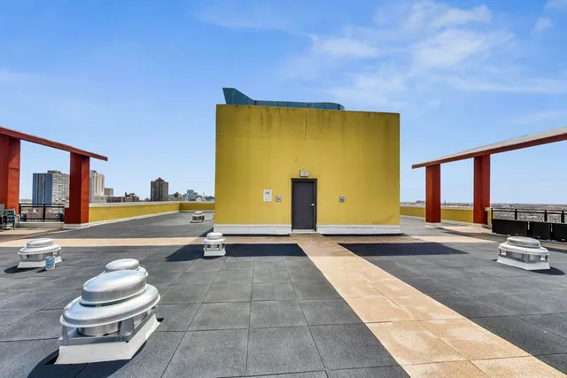 a view of a swimming pool with outdoor seating