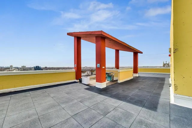 a view of swimming pool with a lounge chair