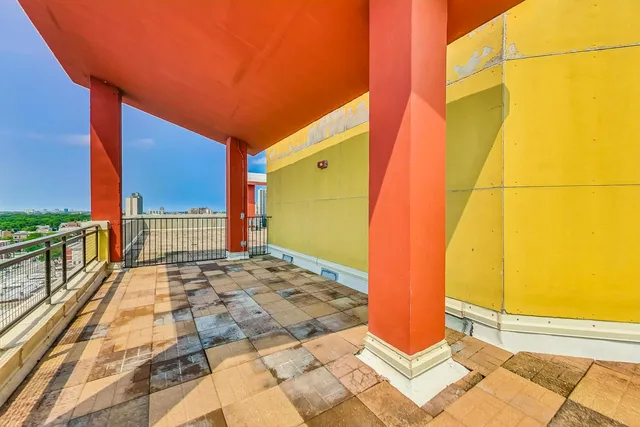 a view of a balcony with city view