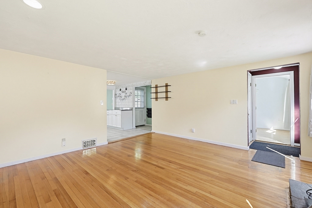 118 Spruce Road Norwood, MA 02062 - Photo 25 of 39 a view of empty room with wooden floor