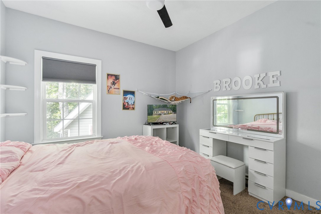 1755 Dispatch Road Quinton, VA 23141 - Photo 48 of 86 a bedroom with a bed window and a table
